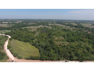 NORTH PIECE AERIAL - SIGNIFICANT LAND & PRODUCING MINERALS AUCTION - 237 +/- SURFACE ACRES IN 4 TRACTS - 18 MINERAL PACKAGES IN GARVIN, MCCLAIN, GRADY & ROGER MILLS COUNTIES, OK - 6 Mo. AVG. CASH FLOW of $196,376/Mo.